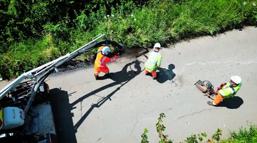 Photo of edge of lane being repaired